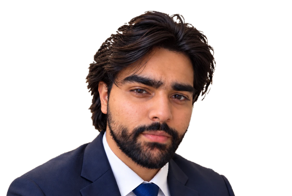 Aazan Mujahid wearing a navy suit and blue tie
